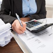 Businessperson Calculating Bills